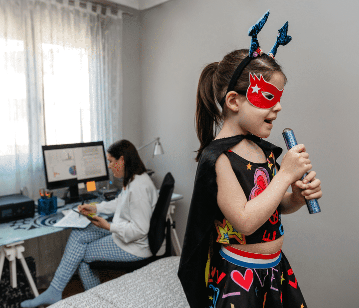 3 ways to better boundaries Child palying while mother tries to work at computer - Julia Ngapo Business Coaching